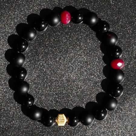 Polshied Onyx and Matte Onyx bracelet accented with Rubies and Gold